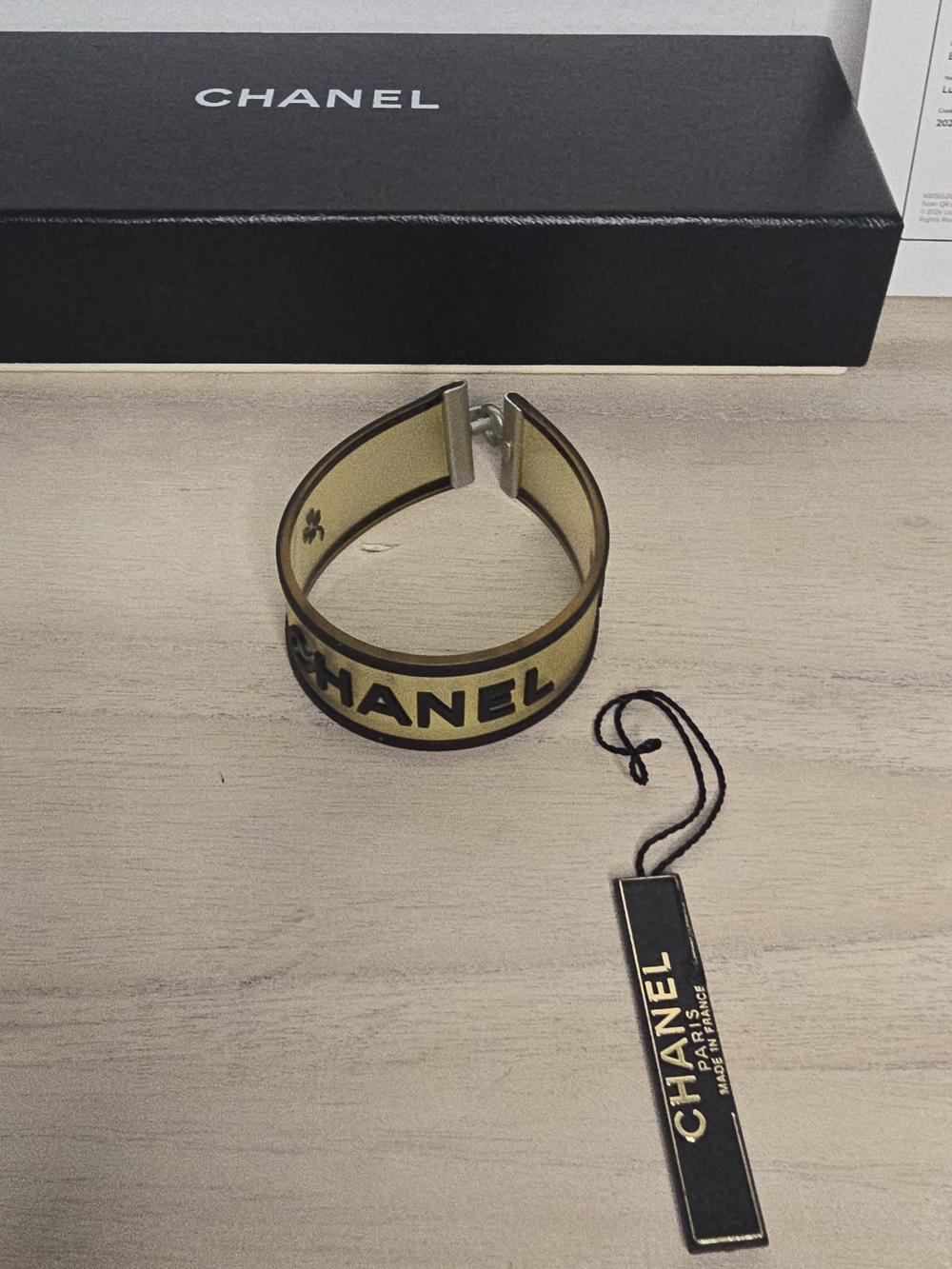 CHANEL Logo Camellia Light Yellow Rubber Cuff Bracelet authenticated